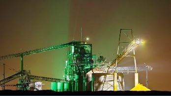 Industrial energy grid facility illuminated at night representing Energy Trading & Bulk Commercial Supply